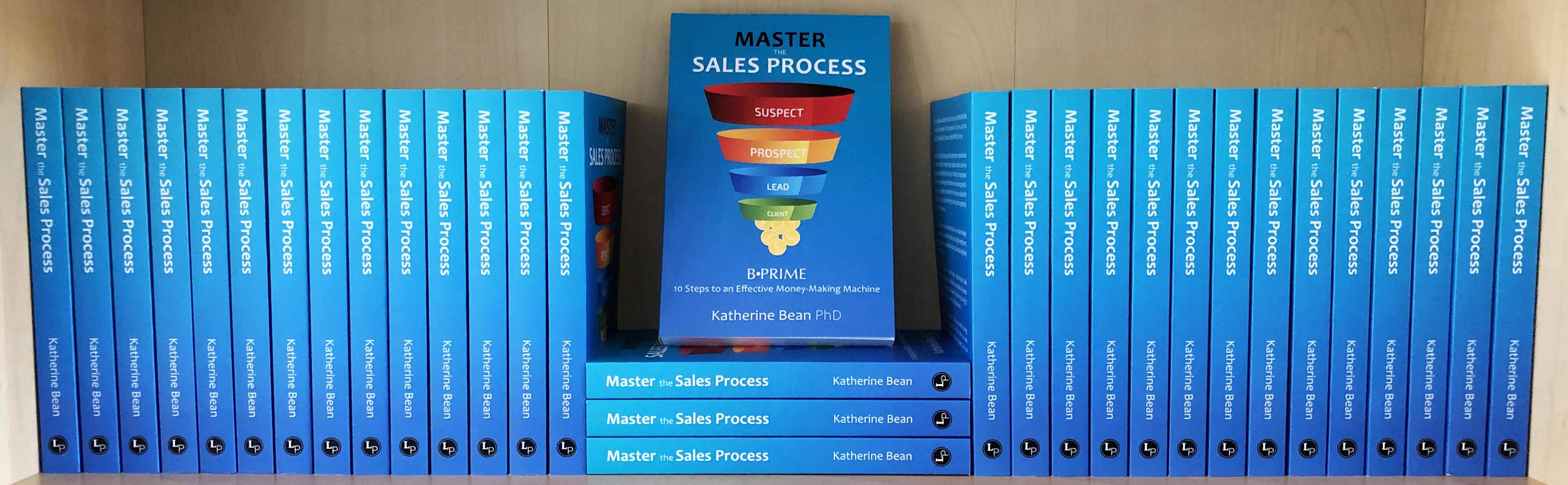 A shelf full of Master the Sales Process books.