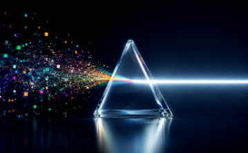 On the left side of the frame, a chaotic, blurred cloud of coloured particles and fragmented data lines represents 